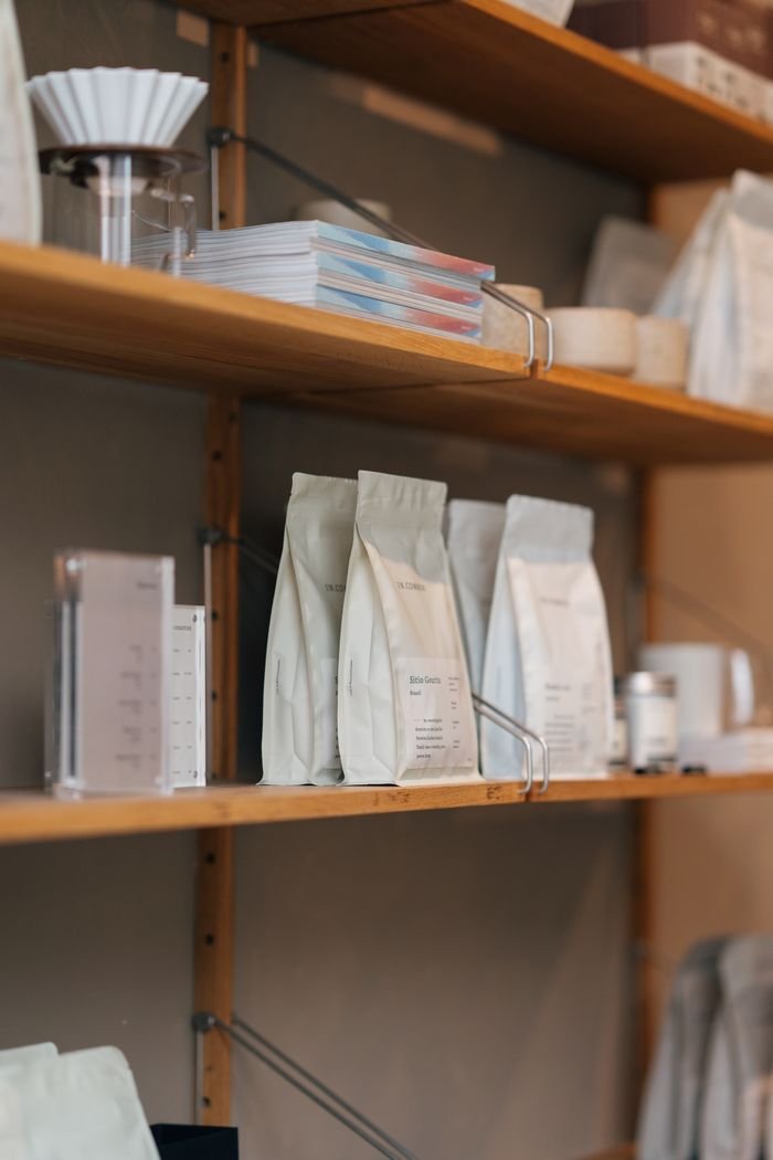 Neatly arranged merchandise on shelves in an Amsterdam store.